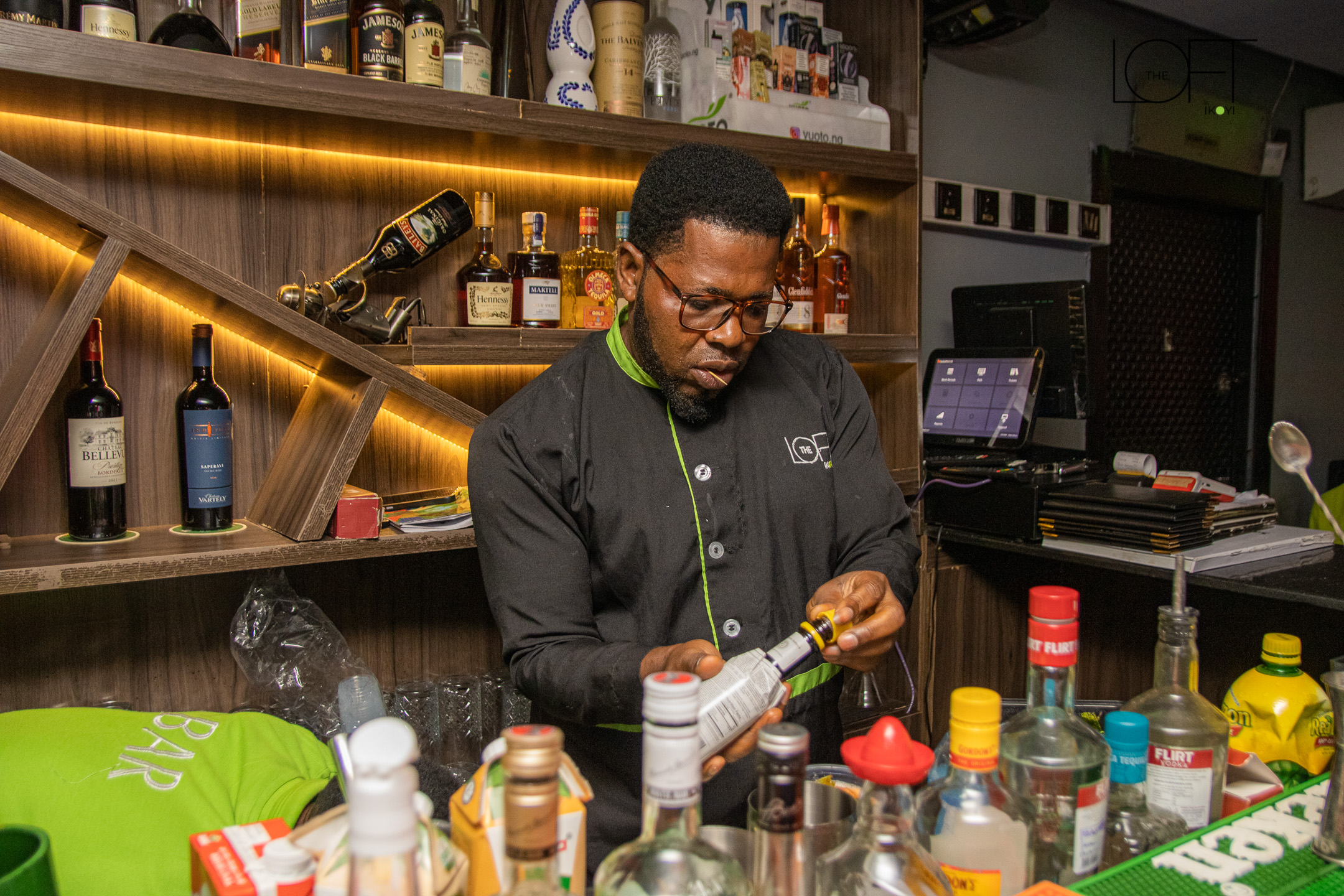 Master Mixologist Crafting Cocktails Behind The Loft Bar